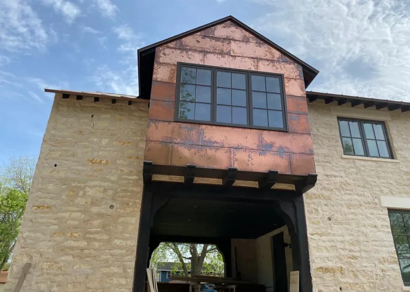 Copper metal panel facade on a stone building for Skylight Installation in Ohio